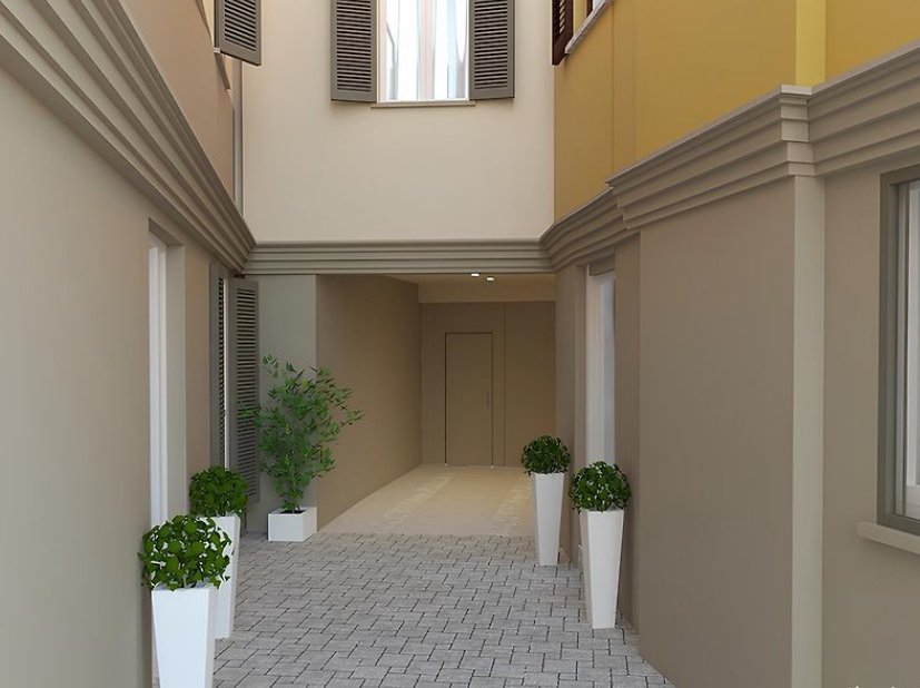 Centro Storico di Monza_02-PF-Archistudio Androne d'ingresso con vasi di piante e pavimentazione in pietra, edificio nel centro storico di Monza